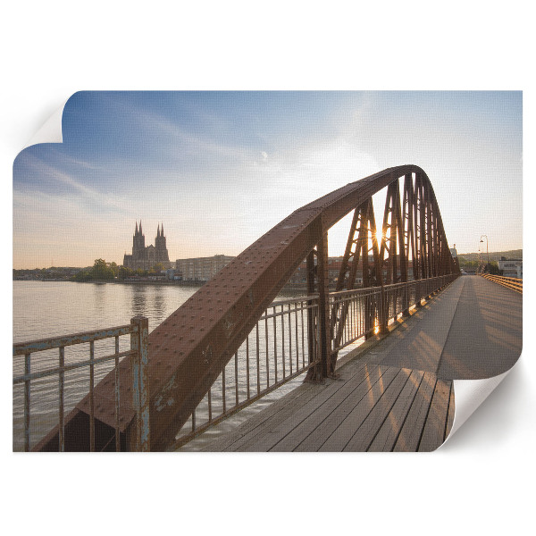 Plakat przedstawiający most wieczorem